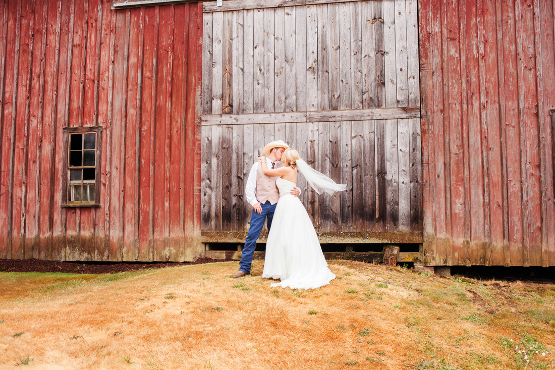 Barn Country Wedding in a field at sunset with cowboy hat Hillsboro Wedding Photographer