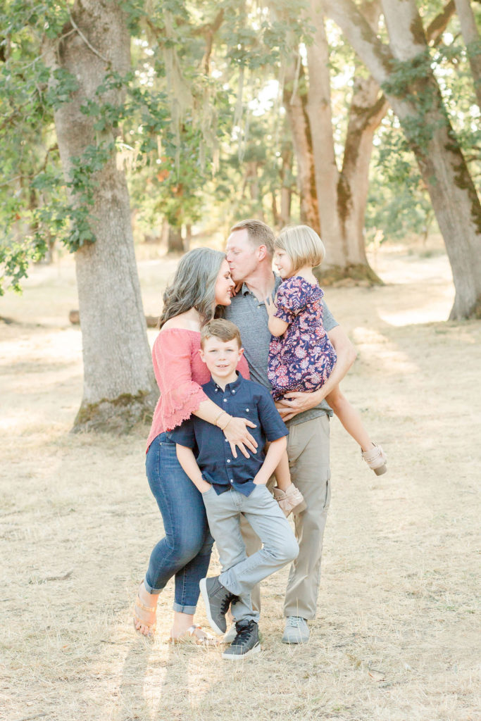 family in an oak grove at champoeg state park for family pictures