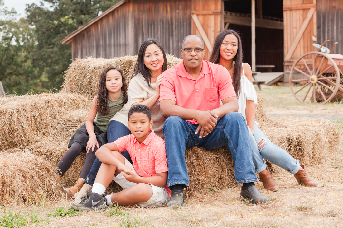 Family picture on hay bales in front of barn at Champoeg State Park in Newberg, OR | Hillsboro Family Photographer