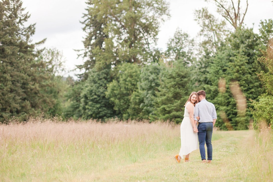 Engagement pictures in the field at Champoeg State Park in Newberg, Oregon | Hillsboro wedding photographer