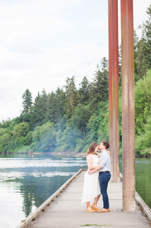 Engagement pictures on the dock at Champoeg State Park in Newberg, Oregon | Hillsboro wedding photographer