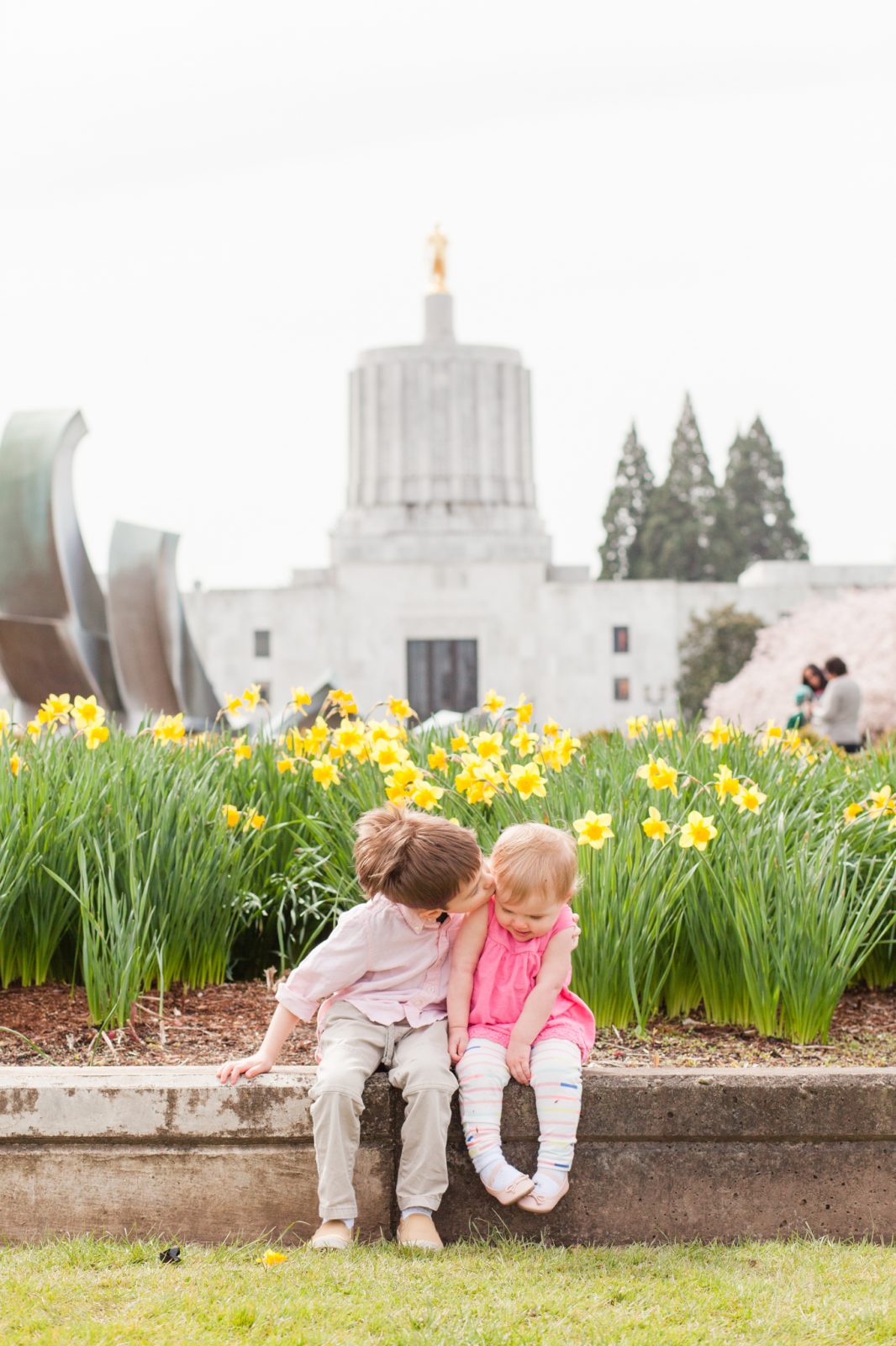 salem cherry blossoms trip in front of the oregon state capitol