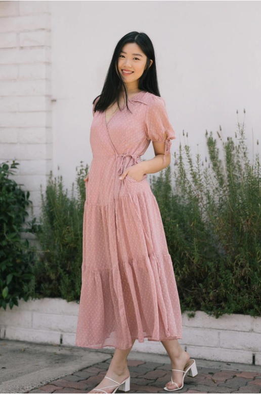 A pink wrap dress from morning lavender, a boutique ideal for dresses for pictures