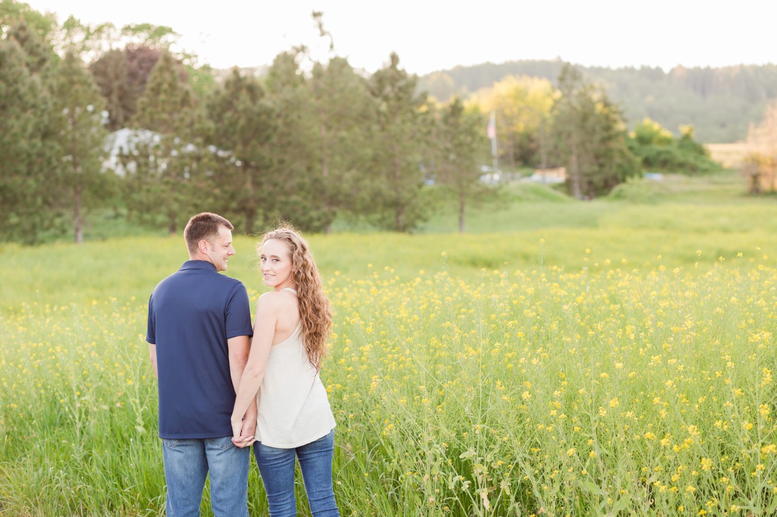 yellow flower field engagement session in mcminnville, oregon