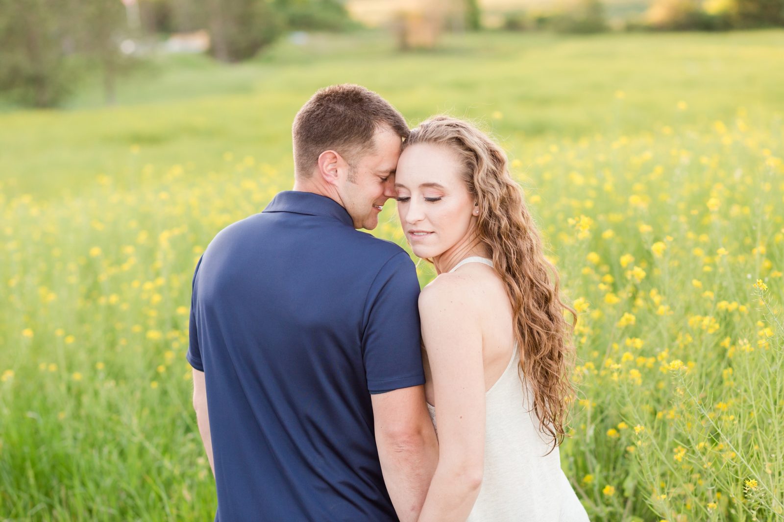 yellow flower field engagement session in mcminnville, oregon