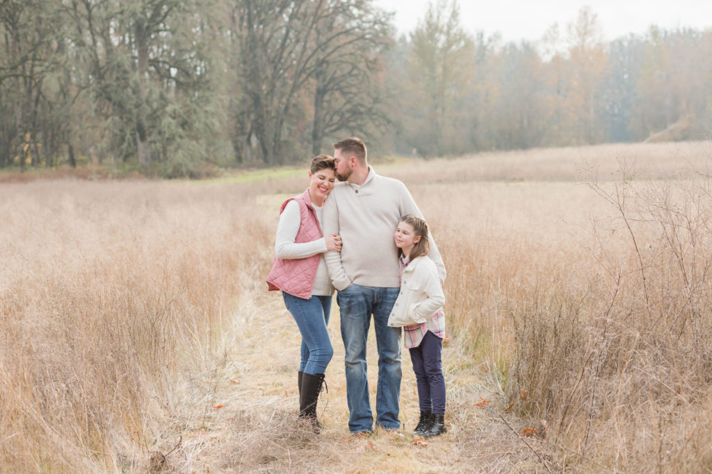 family of three in a field in winter: portland, oregon