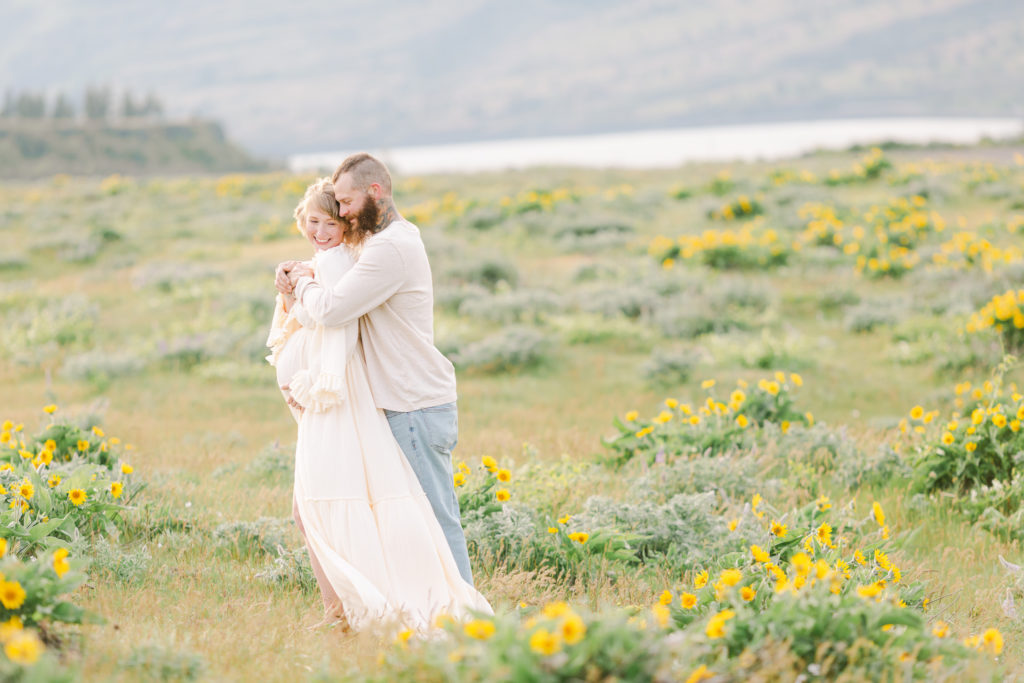 couple at spring maternity photoshoot in the columbia river gorge