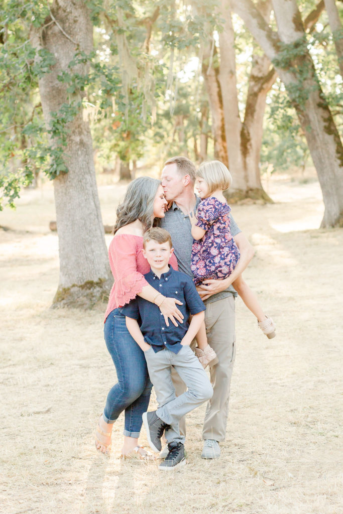 family of four in an oak grove at champoeg state park one of the top outdoor photoshoot locations near Portland, Oregon