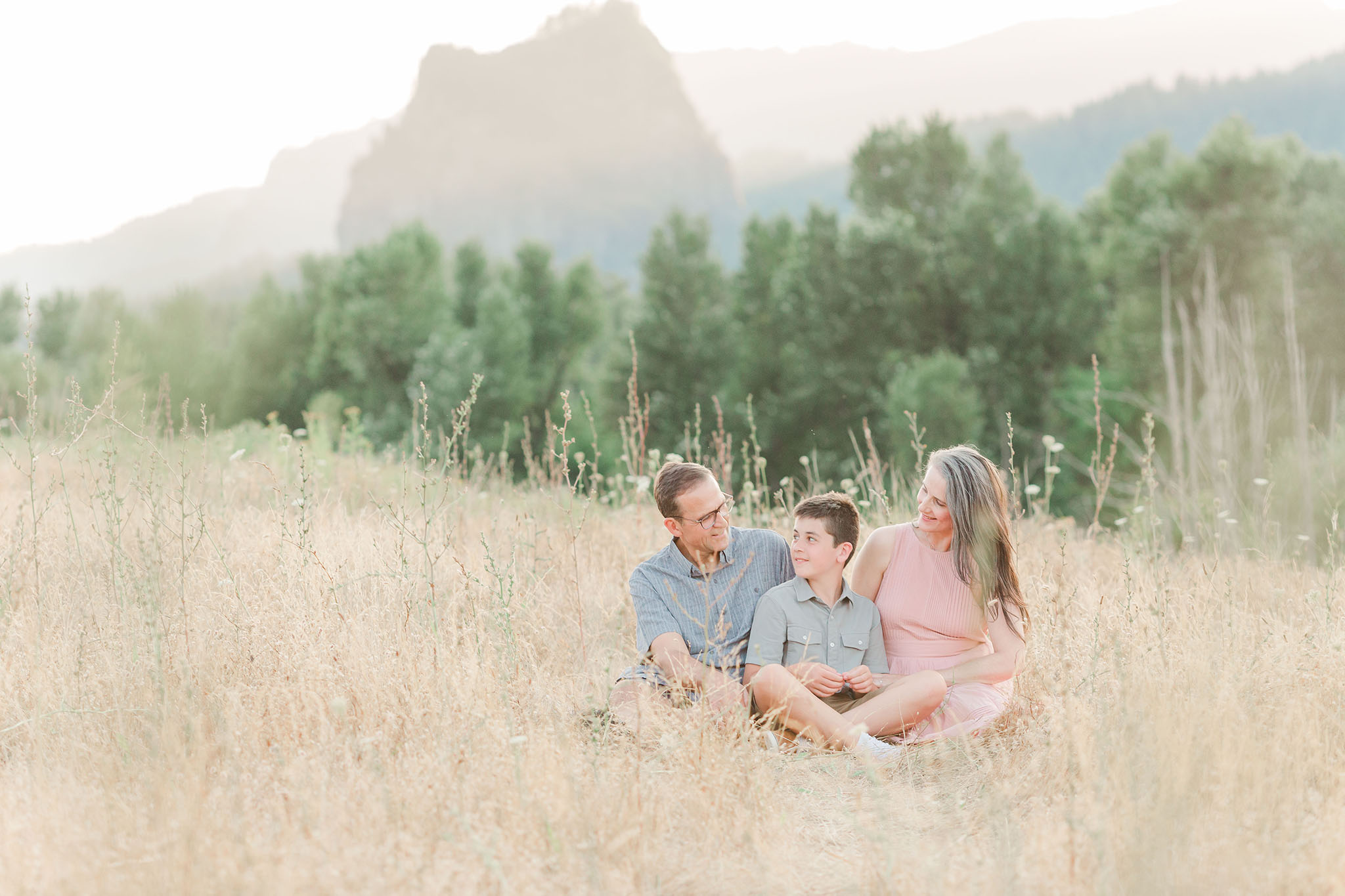 family of three at beacon rock near portland oregon for family photos