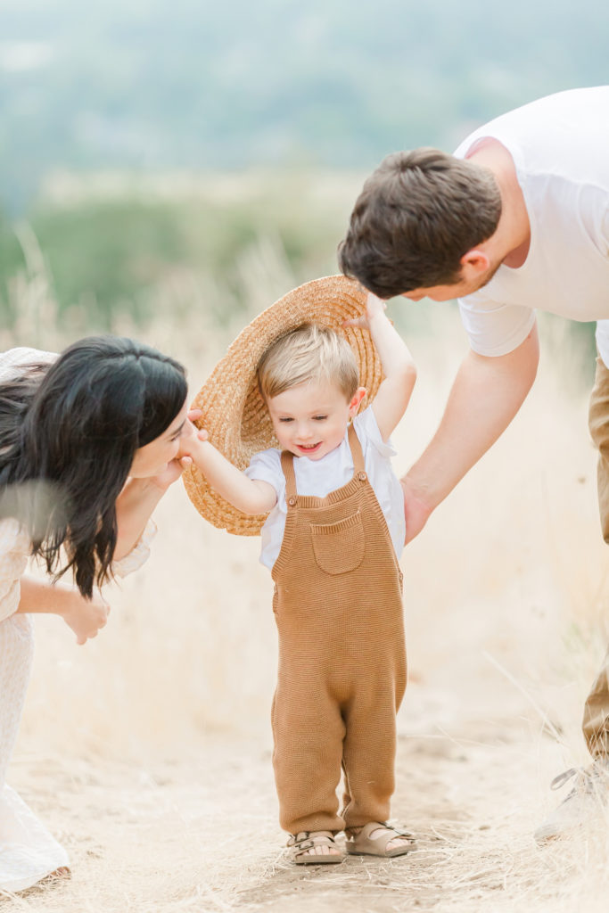 child wearing neutral knit overalls for cottagecore family photos near Corvallis, Oregon