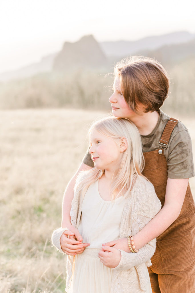 Sisters photographed with a best lens for family portraits, the 85mm lens