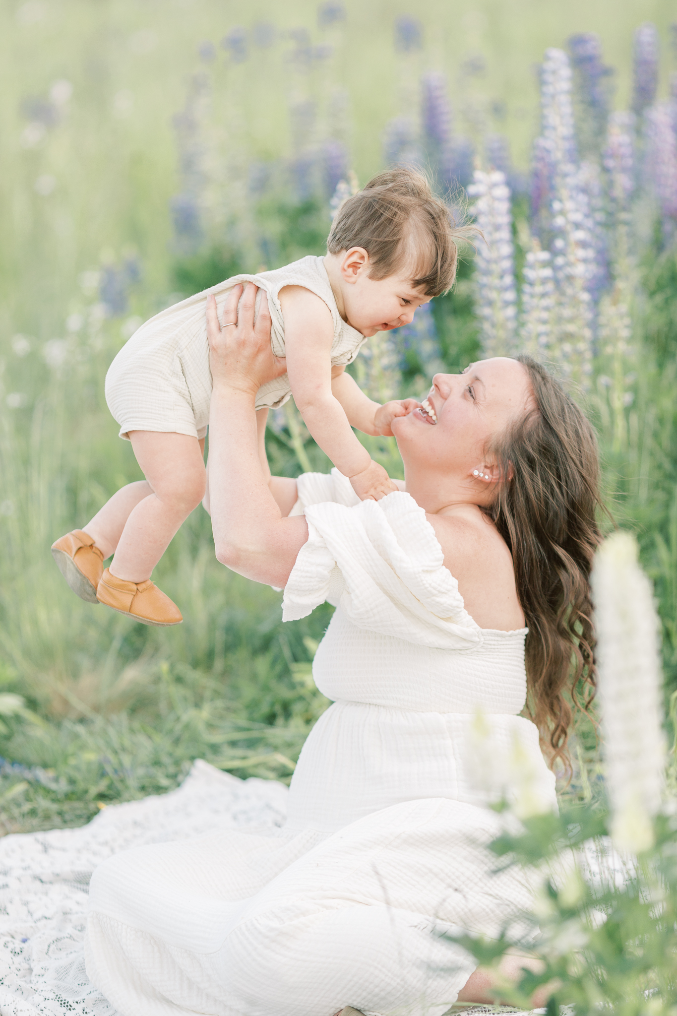 mom and baby in a wildflower field for a motherhood photo session in the PNW.