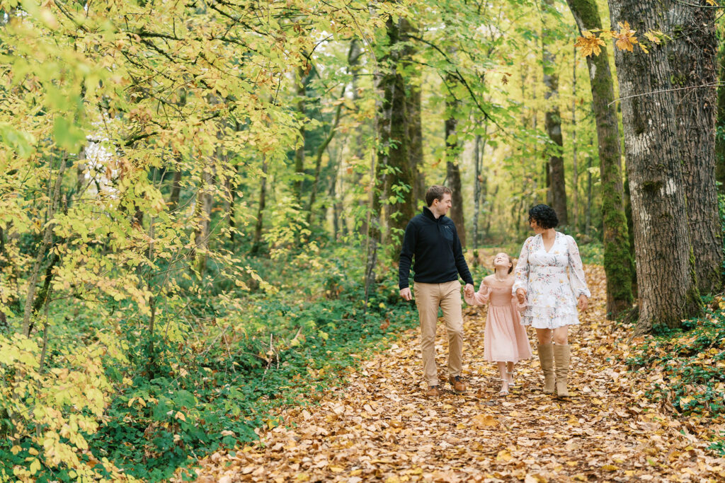 family walks through forest path during forest family photos near portland oregon