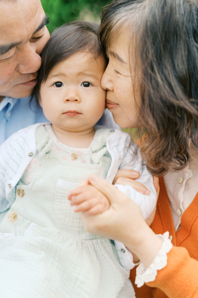 grandparents cuddle baby at schreiner's iris gardens in salem oregon