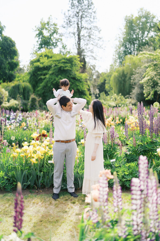 family photo of 3 in the flower garden